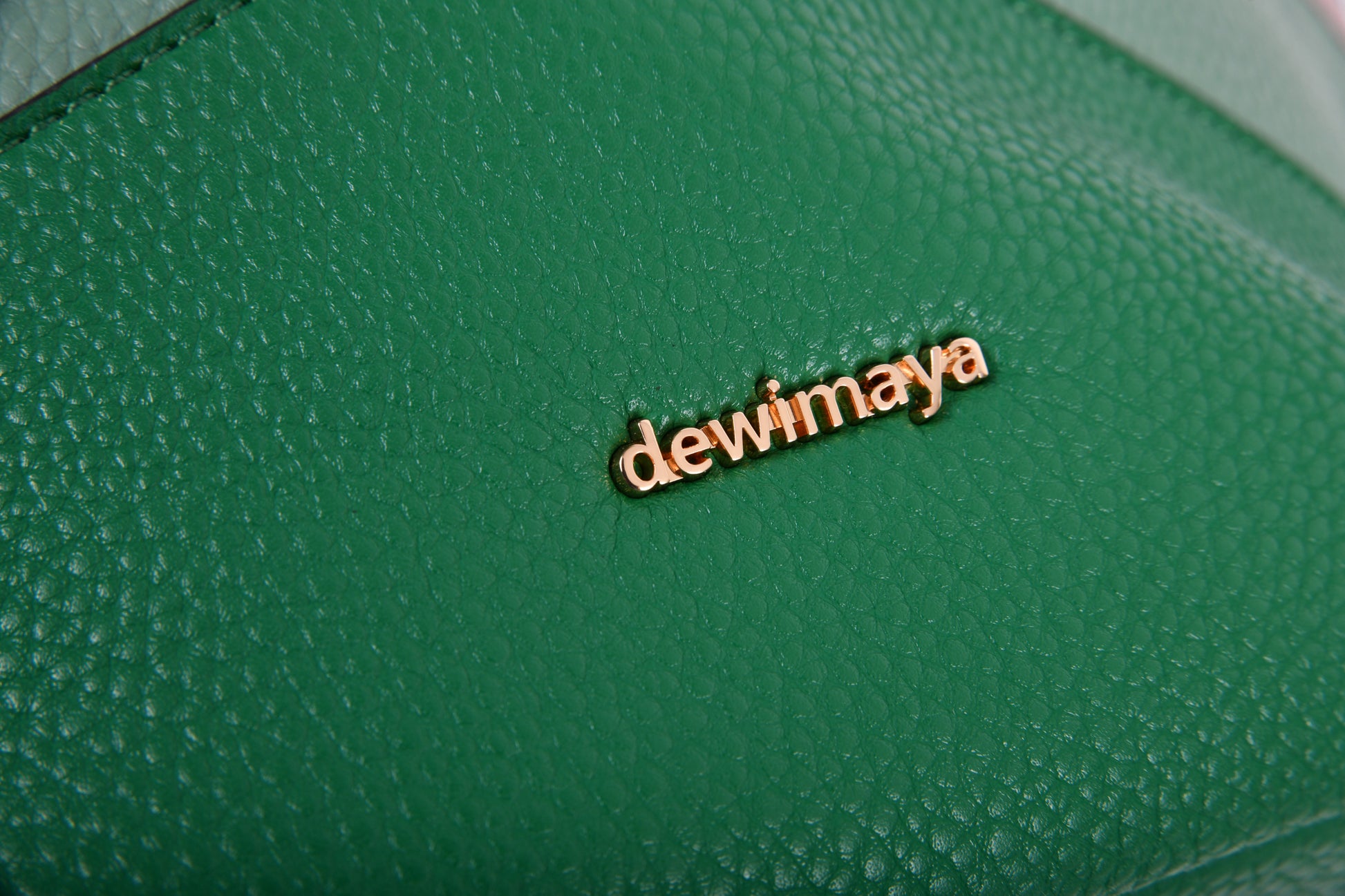 Deyandra Pebble Grain Vegan Leather Green White Purple Bucket Handbag made by Dewi Maya gold logo available at the best boutique in Upstate South Carolina Spartanburg Greenville Dewi Maya Boutique