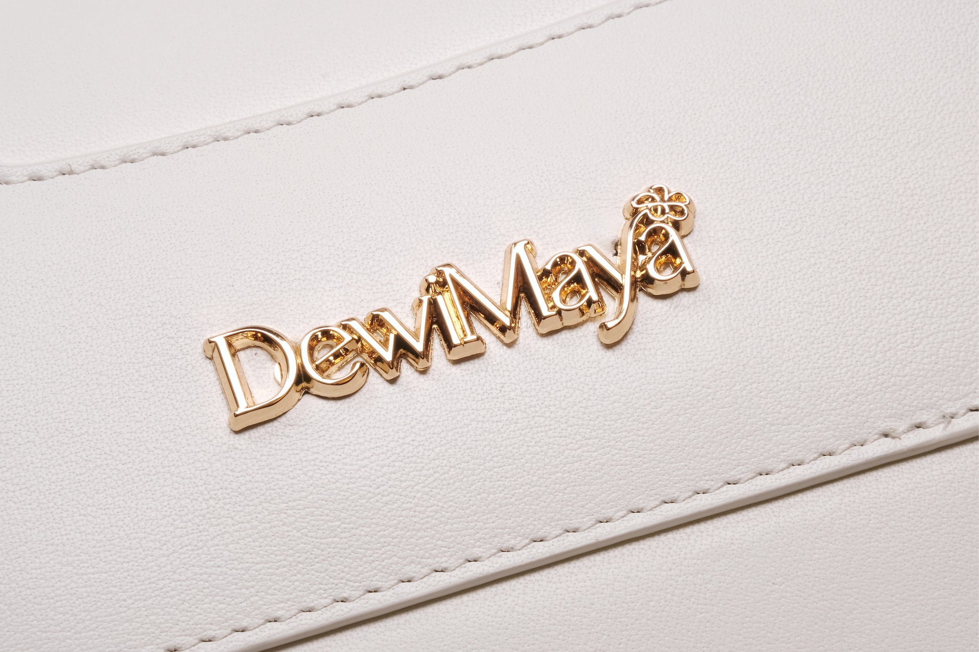 Jasmine White Leather Handbag Made by Dewi Maya gold logo available at the best boutique in Upstate South Carolina Spartanburg Greenville Dewi Maya Boutique