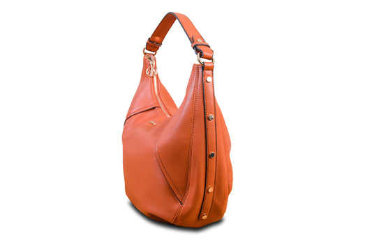 Luna Orange Sunset Crescent Pebble Grain Faux Leather Handbag made by Dewi Maya side view available at the best boutique in Upstate South Carolina Spartanburg Greenville Dewi Maya Boutique