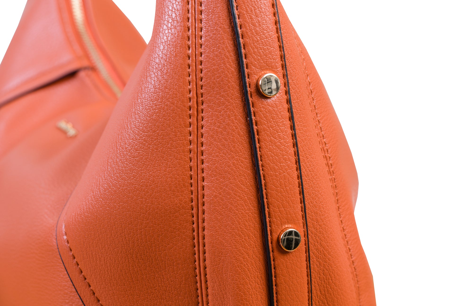 Luna Orange Sunset Crescent Pebble Grain Faux Leather Handbag made by Dewi Maya detail photo of gold rivets available at the best boutique in Upstate South Carolina Spartanburg Greenville Dewi Maya Boutique